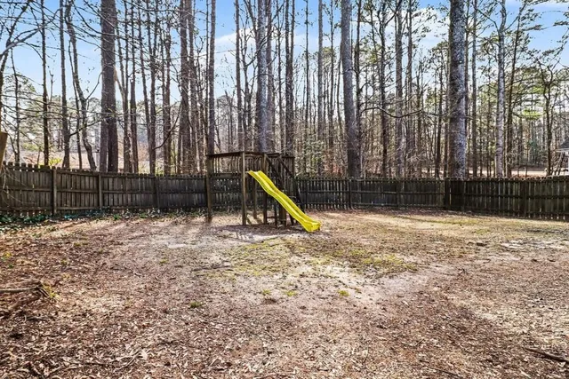 a view of a backyard with swings