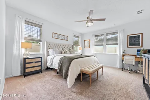 a bedroom with a bed and a table