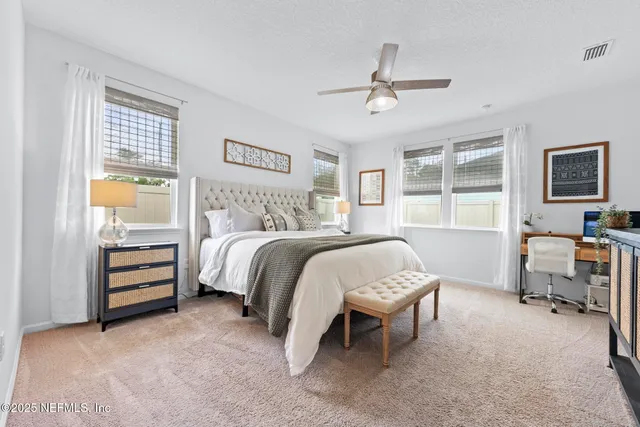 a bedroom with a bed and a table