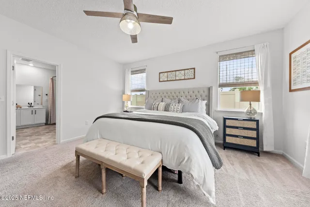a view of a bathroom with a shower and a sink