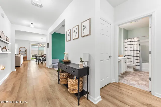 a view of a livingroom with furniture and a flat screen tv