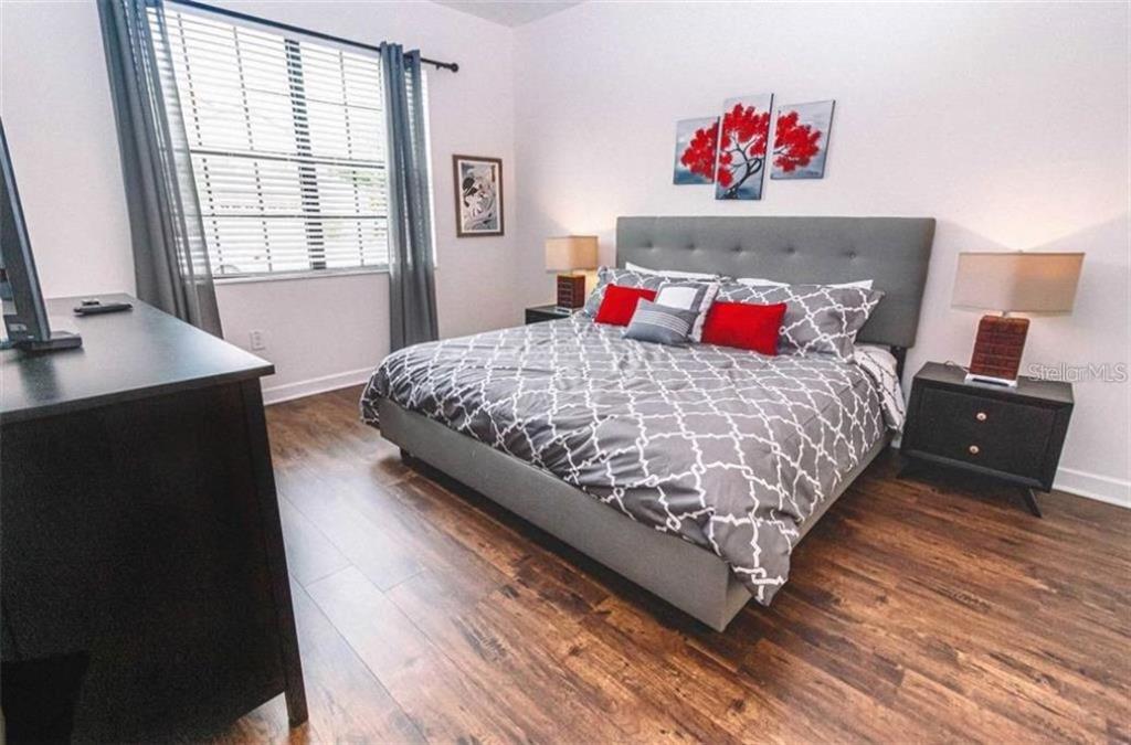 1427 Thunderbird Road Davenport, FL 33896 - Photo 15 of 52 a bedroom with a bed and a window