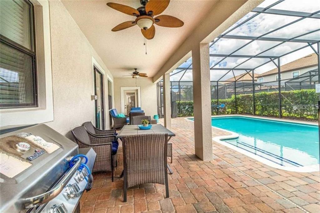 1427 Thunderbird Road Davenport, FL 33896 - Photo 18 of 52 a view of a dining room with furniture window and outside view