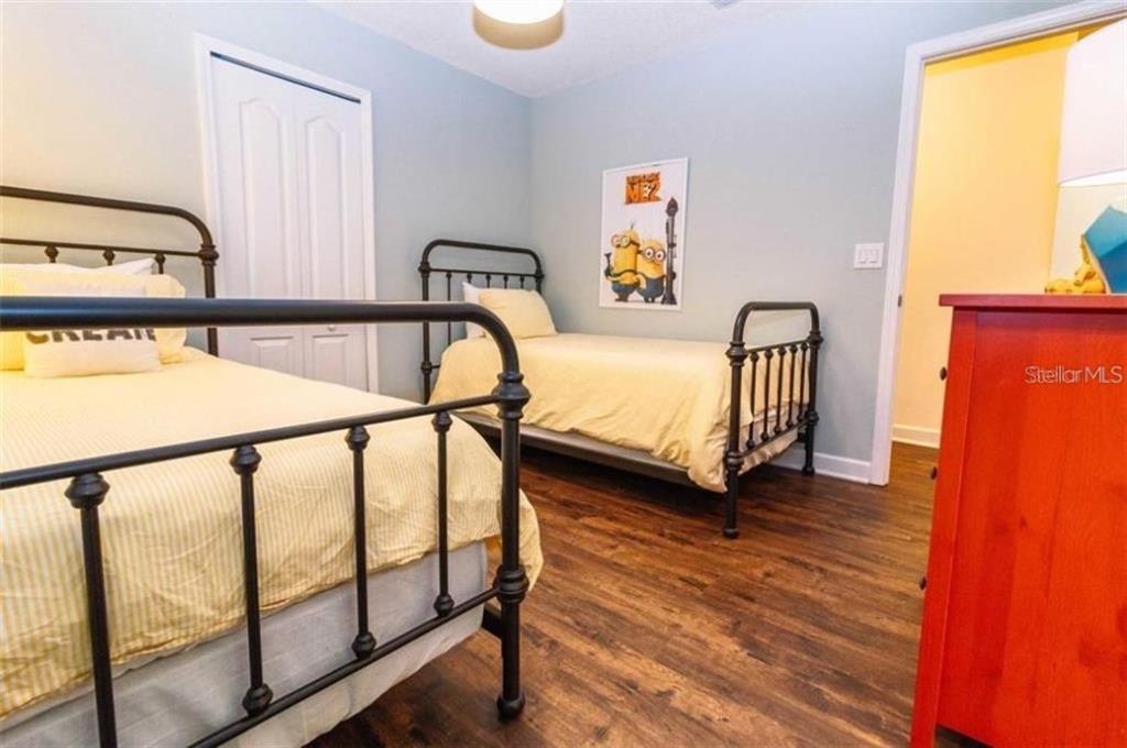 1427 Thunderbird Road Davenport, FL 33896 - Photo 27 of 52 a bedroom with 2 bed and a window