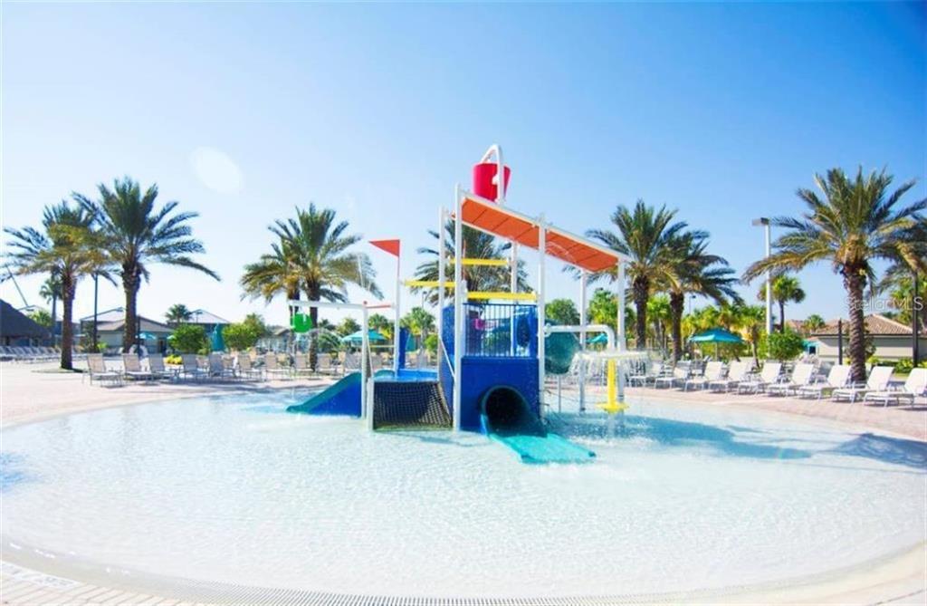 1427 Thunderbird Road Davenport, FL 33896 - Photo 37 of 52 a front view of a house with outdoor space and palm trees