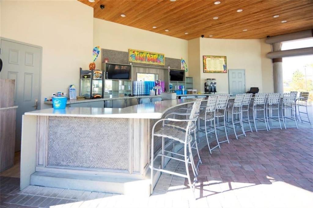 1427 Thunderbird Road Davenport, FL 33896 - Photo 41 of 52 a view of a dining room with furniture