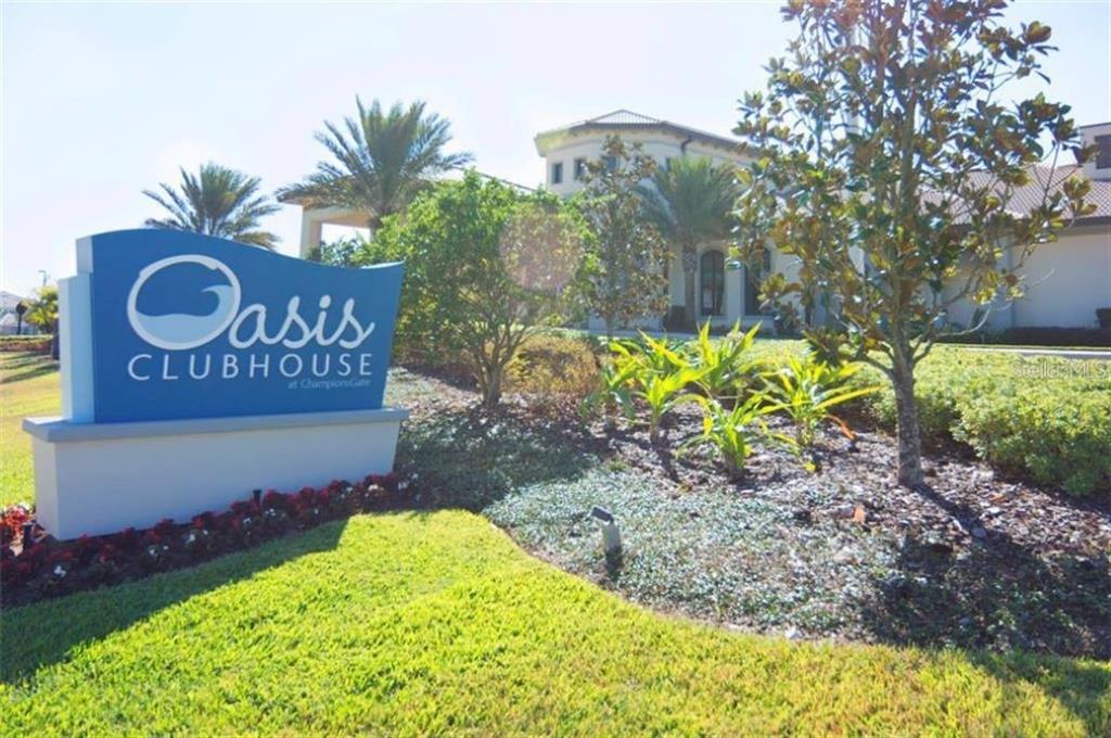 1427 Thunderbird Road Davenport, FL 33896 - Photo 45 of 52 a sign that is sitting in front of flowers