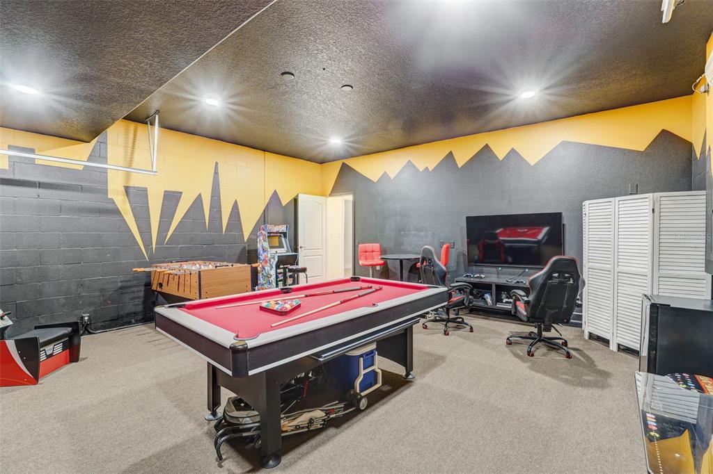 1427 Thunderbird Road Davenport, FL 33896 - Photo 51 of 52 a room with pool table and a flat screen tv