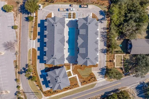 an aerial view of residential houses with outdoor space