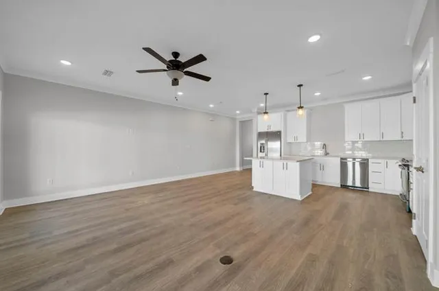 a view of kitchen with wooden floor
