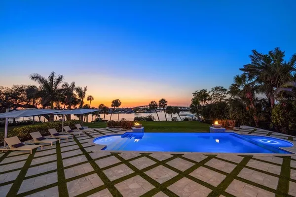 a view of swimming pool with outdoor seating