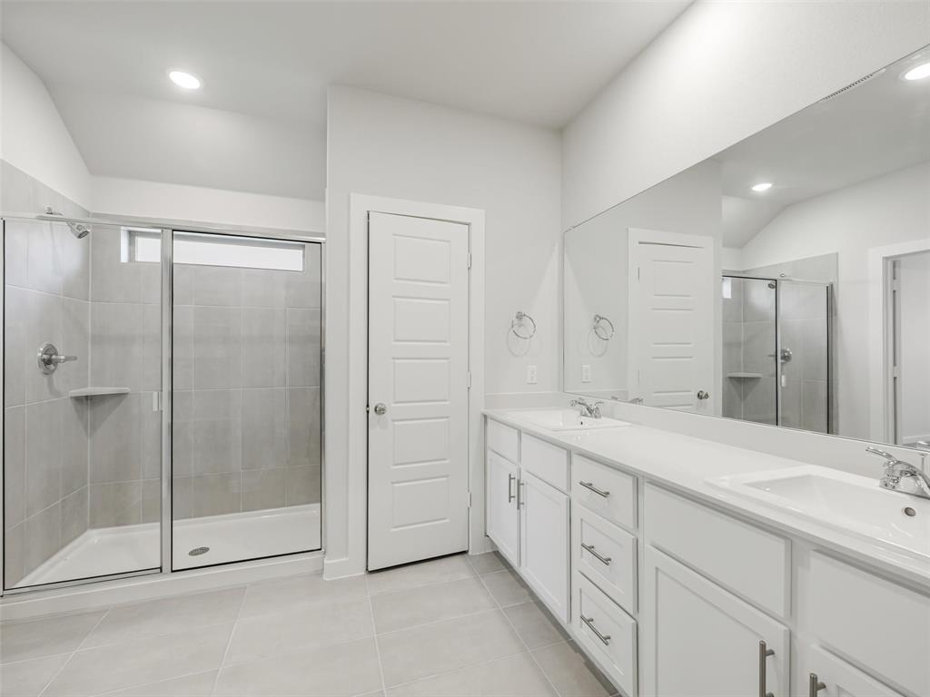 1136 Del Rio Drive Lavon, TX 75166 - Photo 19 of 30 Primary Bathroom featuring dual vanities with white cabinetry, white quartz countertops, and chrome fixtures