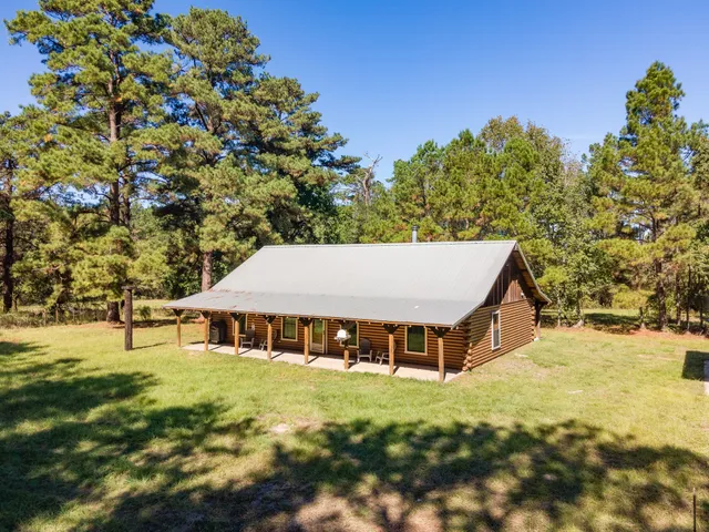 a house with trees in the background