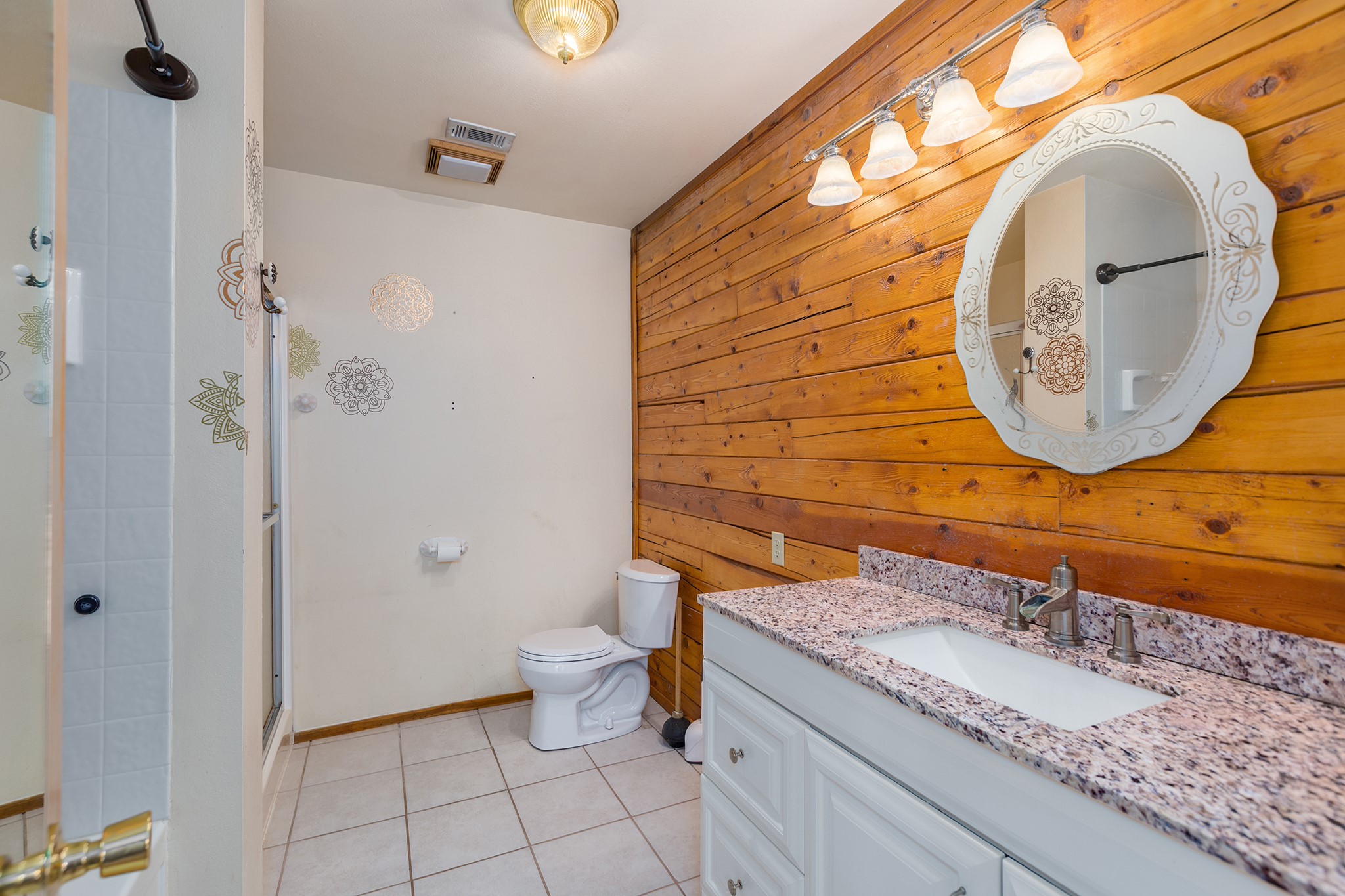 1152 Loving Road Lufkin, TX 75901 - Photo 19 of 42 a bathroom with a granite countertop sink and a mirror