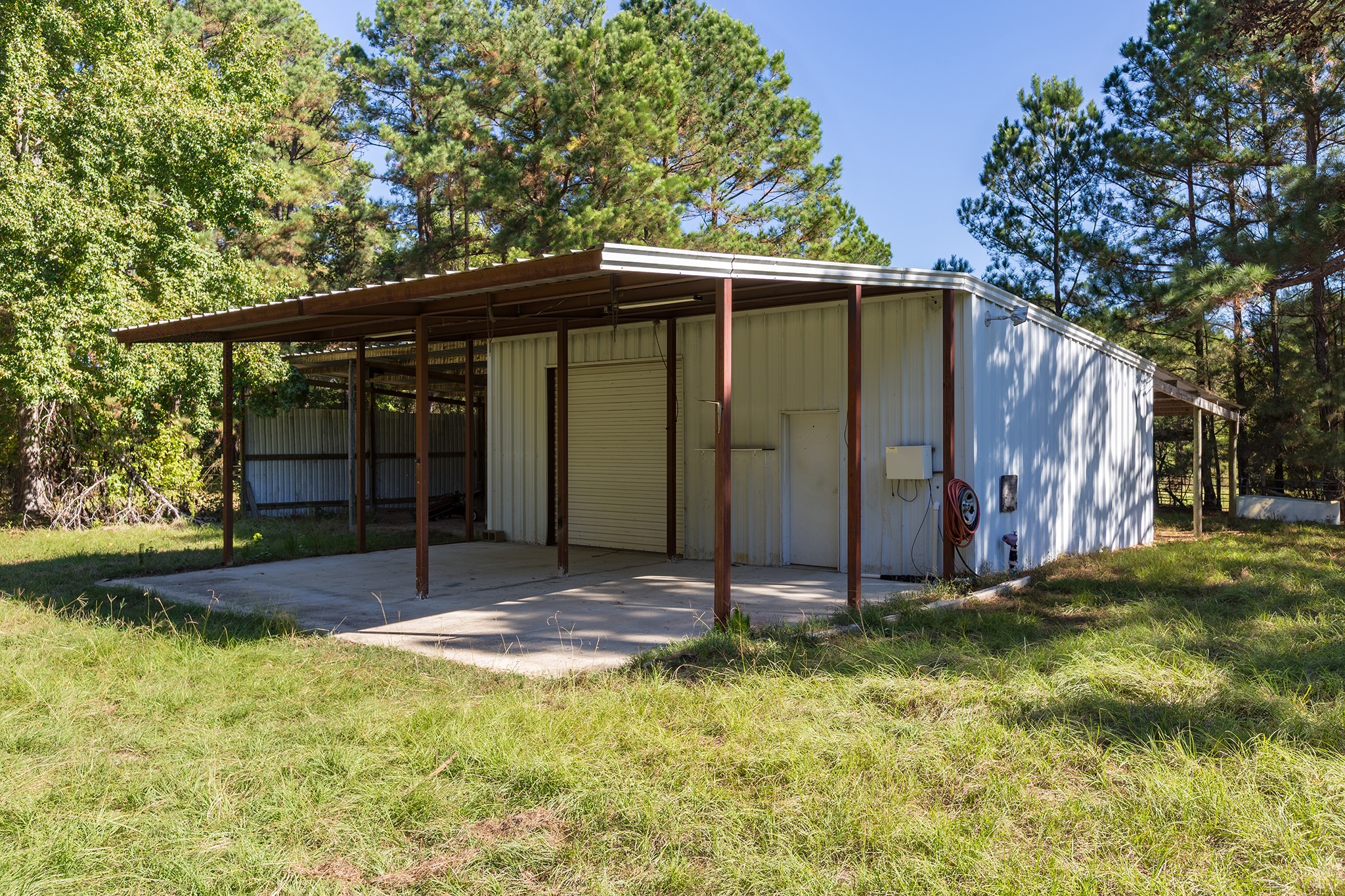 1152 Loving Road Lufkin, TX 75901 - Photo 25 of 42 a backyard of a house with garden and porch