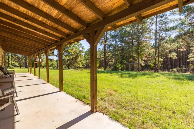 a view of swimming pool with an outdoor seating