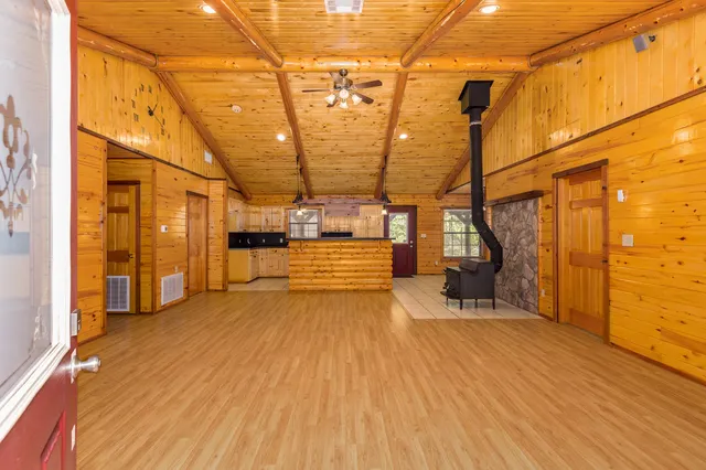 a view of a patio with table and chairs