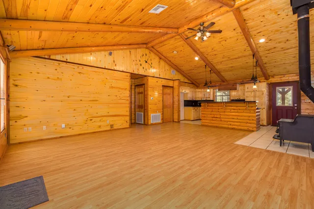 a view of a room with wooden floor