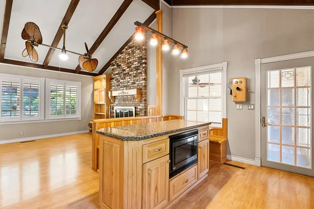 a kitchen with stainless steel appliances granite countertop a stove and a sink