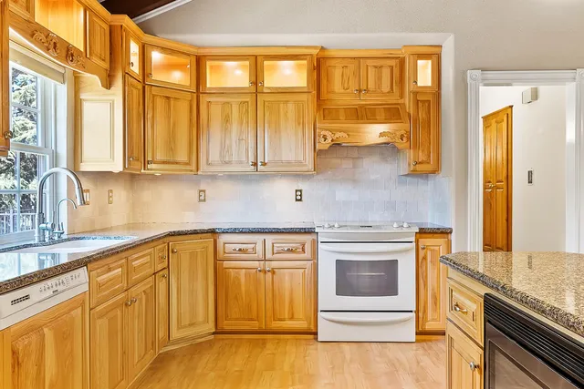 a room with wooden cabinets and a window