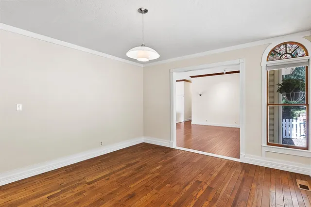 a view of room with wooden floor