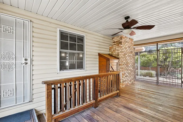 a view of a balcony with wooden floor
