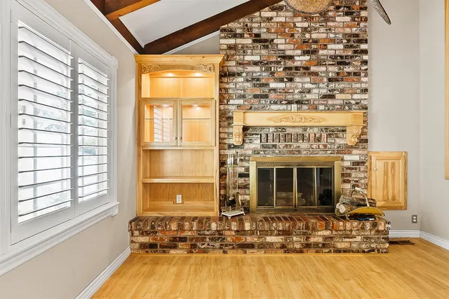 a view of livingroom with hardwood floor and front door