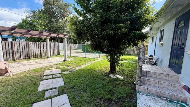 a view of backyard with tree