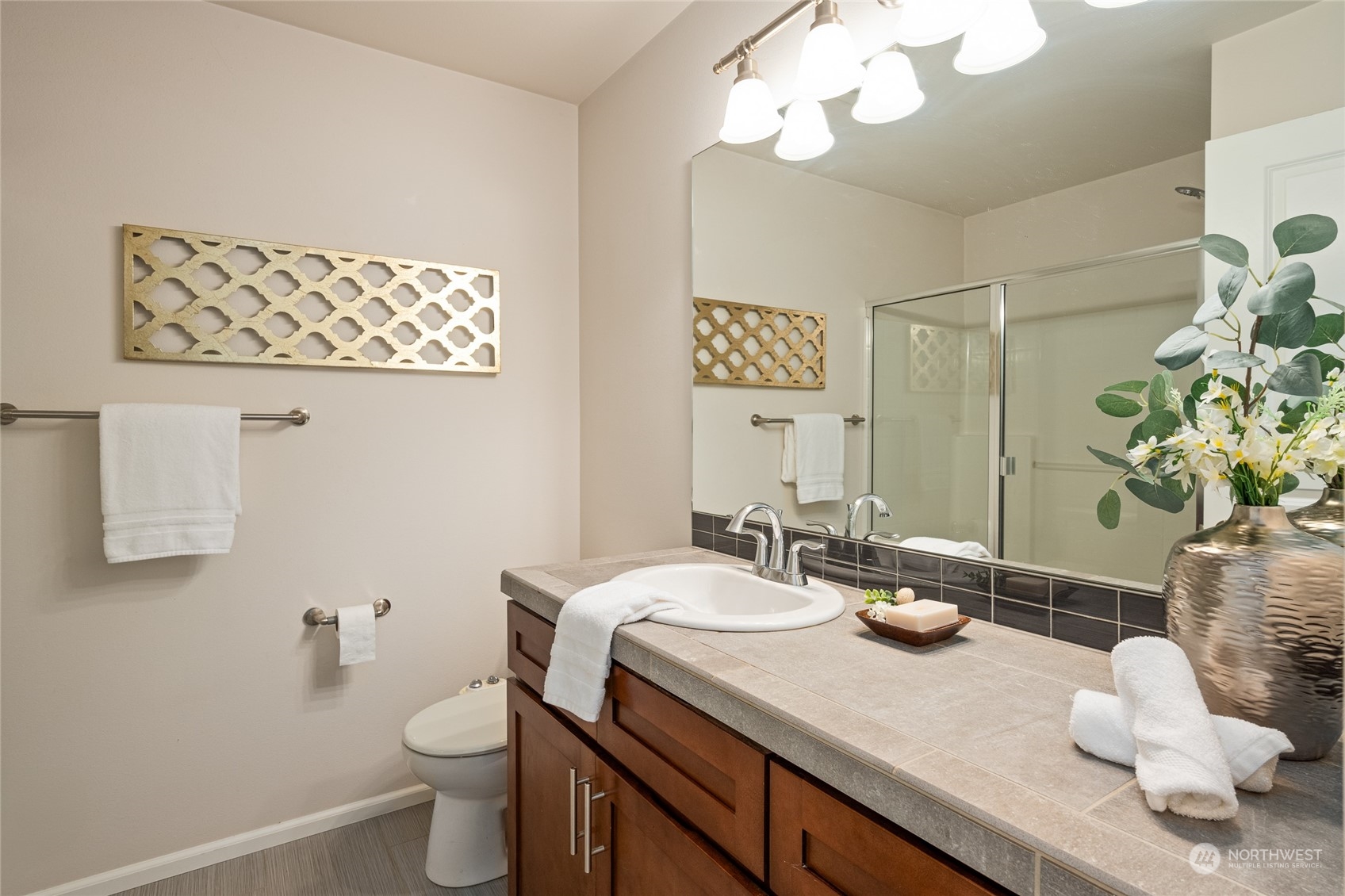 3312 31st Drive Everett, WA 98201 - Photo 15 of 27 a bathroom with a sink a mirror and a toilet