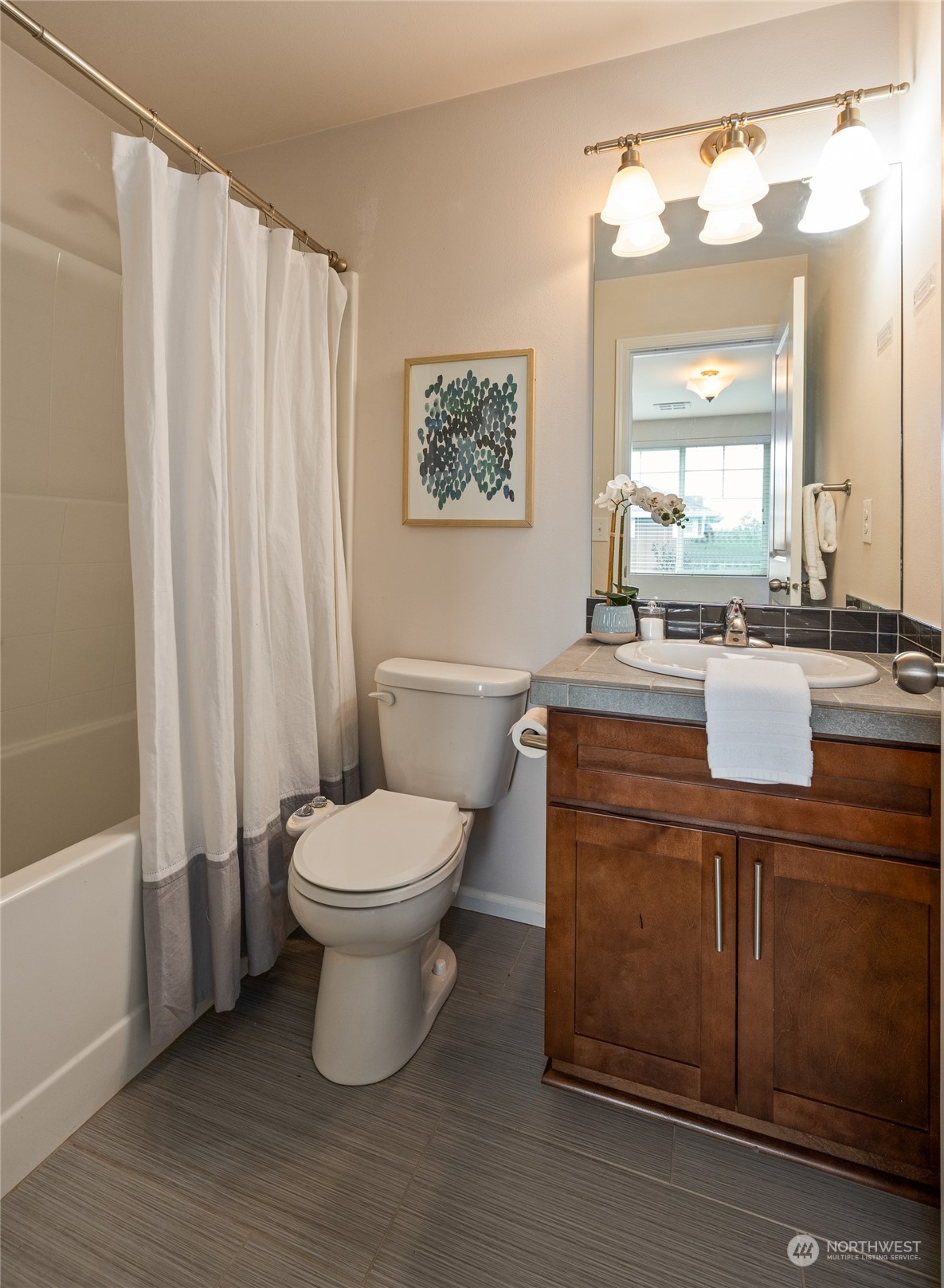 3312 31st Drive Everett, WA 98201 - Photo 17 of 27 a bathroom with a toilet a sink and a mirror