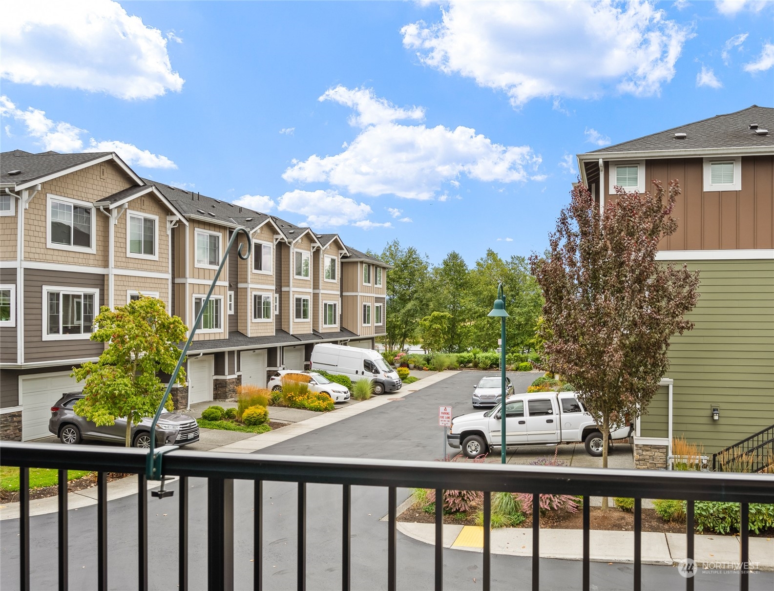 3312 31st Drive Everett, WA 98201 - Photo 19 of 27 a view of a brick house with a chairs and table in a patio