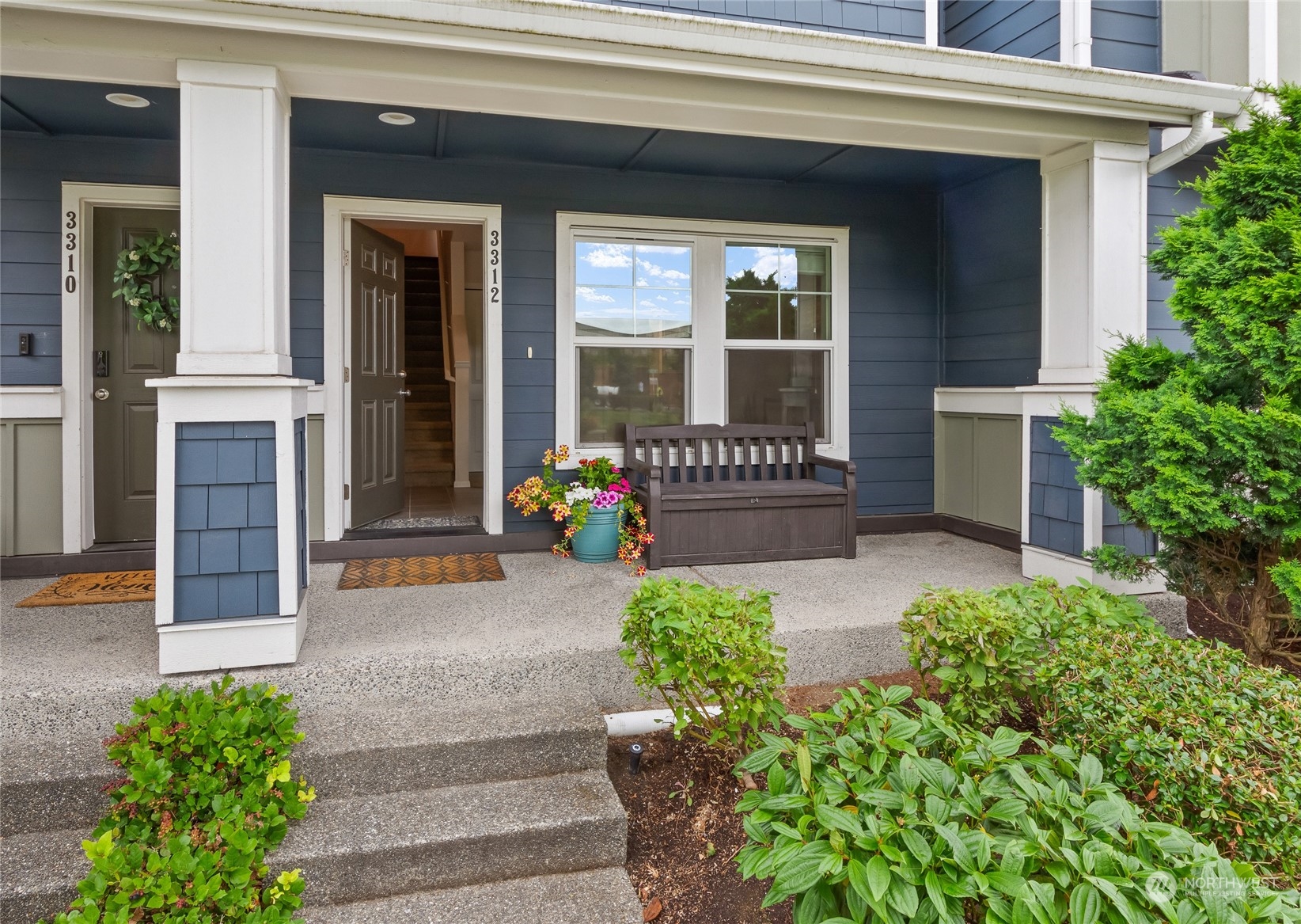 3312 31st Drive Everett, WA 98201 - Photo 3 of 27 a front view of a house with a garden