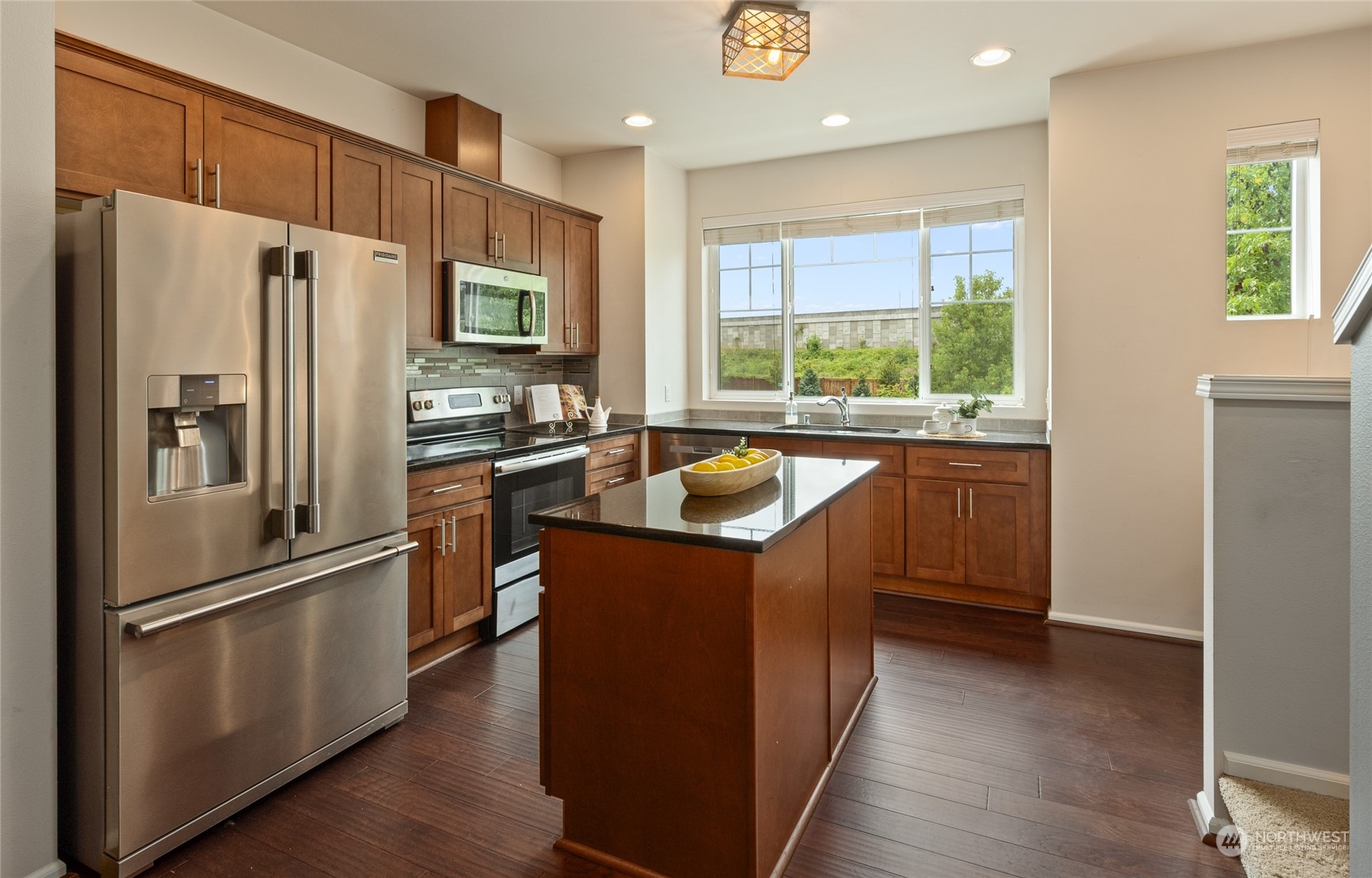 3312 31st Drive Everett, WA 98201 - Photo 6 of 27 a kitchen with stainless steel appliances granite countertop a refrigerator a sink a stove and a refrigerator