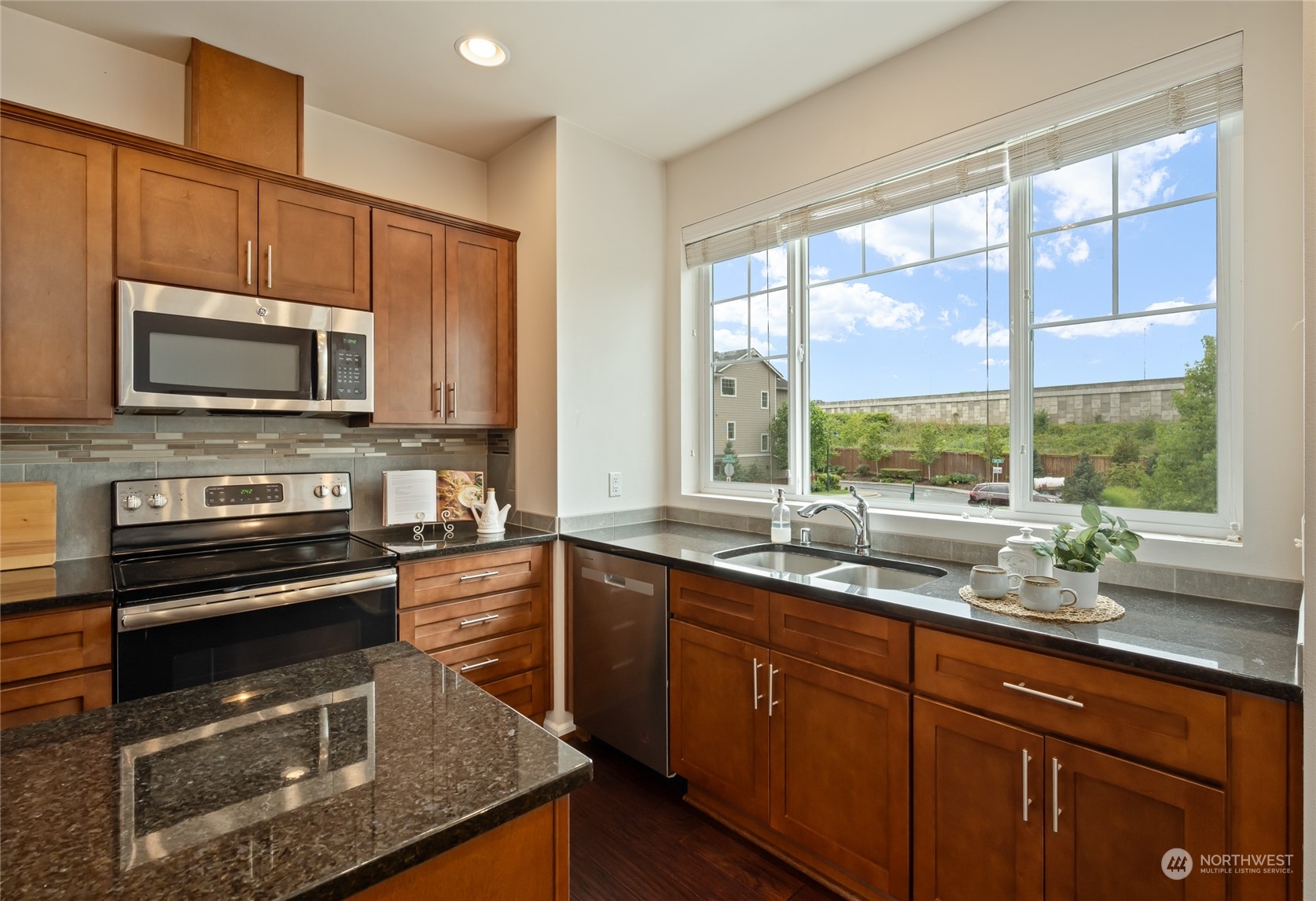 3312 31st Drive Everett, WA 98201 - Photo 8 of 27 a kitchen with a sink a stove and a microwave