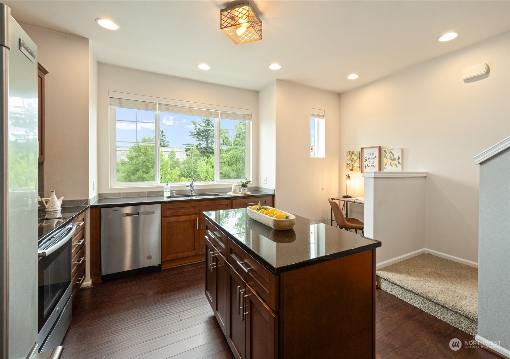 3312 31st Drive Everett, WA 98201 - Photo 9 of 27 a kitchen that has a sink a stove and a refrigerator