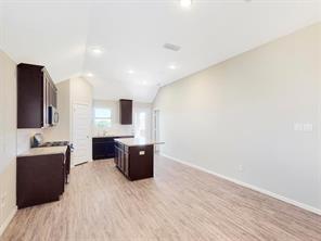 3421 Buster Way Corinth, TX 76210 - Photo 6 of 11 a view of a living room with furniture and a flat screen tv