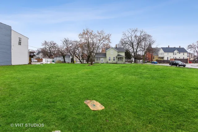 a house with a big yard and large trees