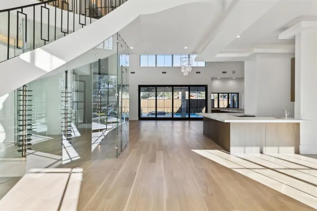 a view of a living room and kitchen with a large window