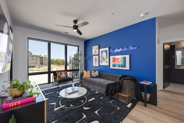 a living room with furniture and a large window