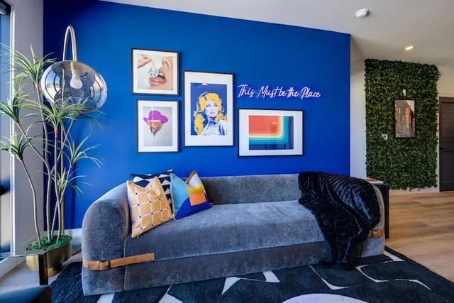 a living room with furniture and a potted plant