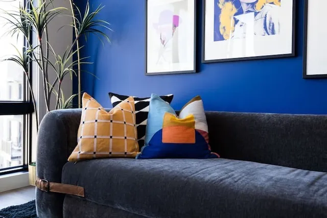 a bedroom with furniture and a potted plant