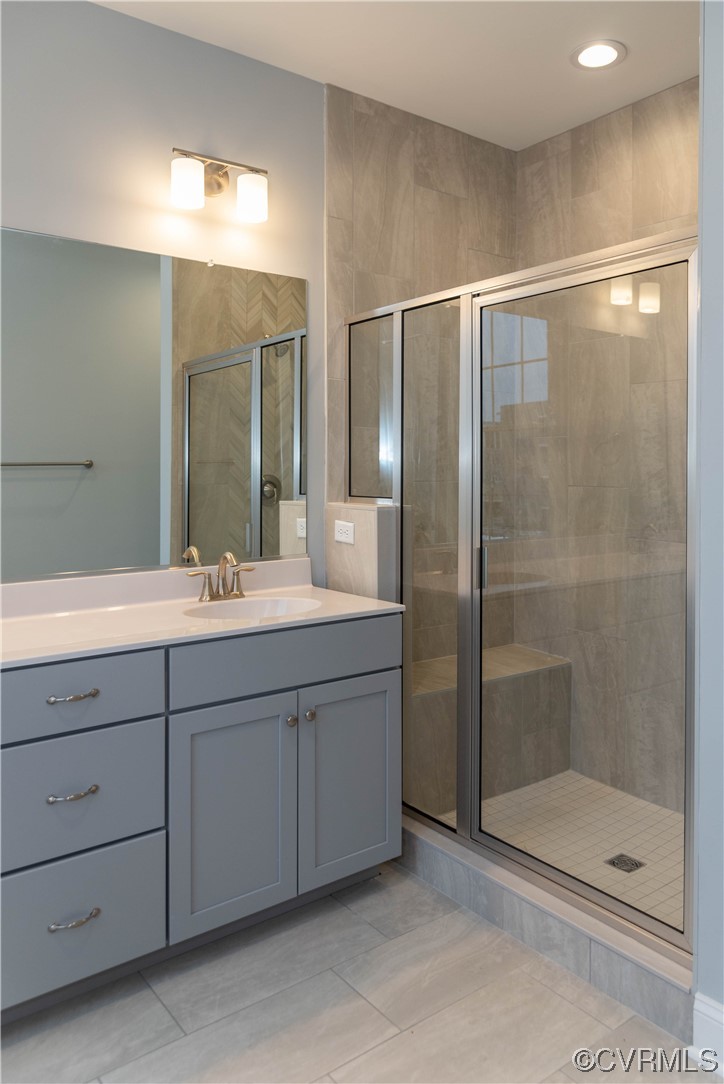 1712 Old Brick Road, Unit 13A Henrico, VA 23233 - Photo 11 of 25 a bathroom with a shower sink and mirror