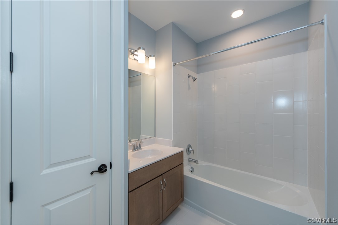 1712 Old Brick Road, Unit 13A Henrico, VA 23233 - Photo 16 of 25 a bathroom with a tub shower vanity and a sink