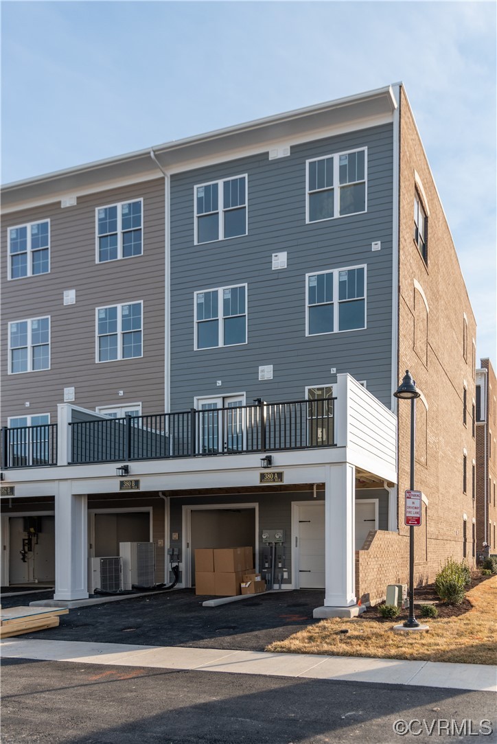 1712 Old Brick Road, Unit 13A Henrico, VA 23233 - Photo 18 of 25 a front view of residential houses with yard