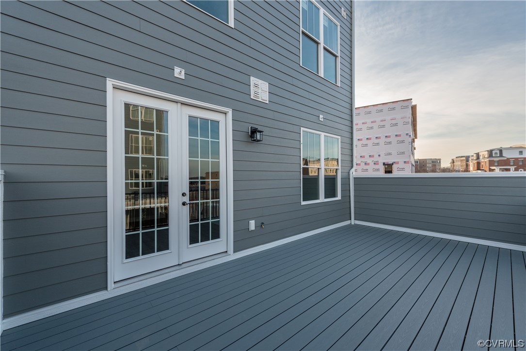 1712 Old Brick Road, Unit 13A Henrico, VA 23233 - Photo 2 of 25 an empty room with wooden floor and windows