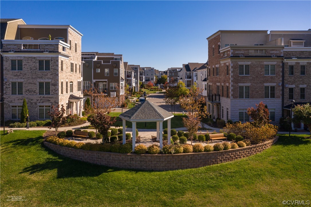 1712 Old Brick Road, Unit 13A Henrico, VA 23233 - Photo 24 of 25 a view of a house with a yard table and chairs