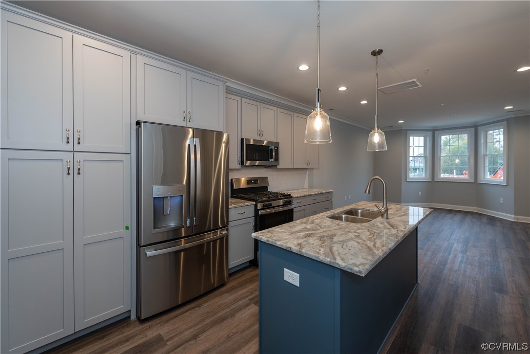 1712 Old Brick Road, Unit 13A Henrico, VA 23233 - Photo 4 of 25 a kitchen with kitchen island a counter top space cabinets and stainless steel appliances