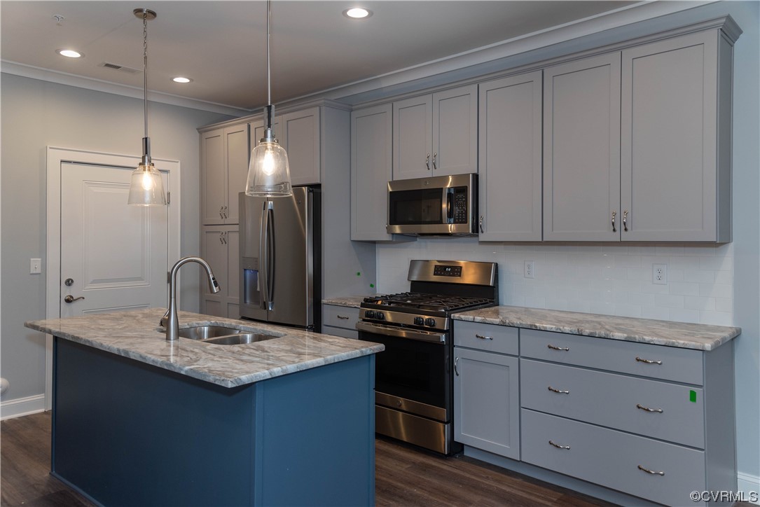 1712 Old Brick Road, Unit 13A Henrico, VA 23233 - Photo 5 of 25 a kitchen with kitchen island granite countertop stainless steel appliances a sink stove and refrigerator