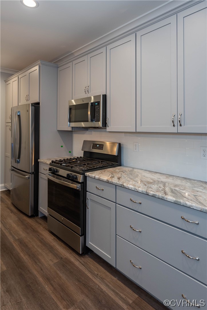 1712 Old Brick Road, Unit 13A Henrico, VA 23233 - Photo 6 of 25 a kitchen with granite countertop white cabinets and stainless steel appliances