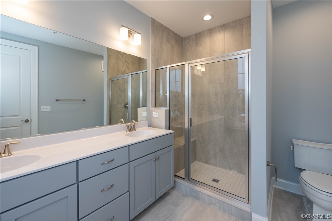 1712 Old Brick Road, Unit 13A Henrico, VA 23233 - Photo 10 of 25 a bathroom with a shower sink vanity mirror and toilet